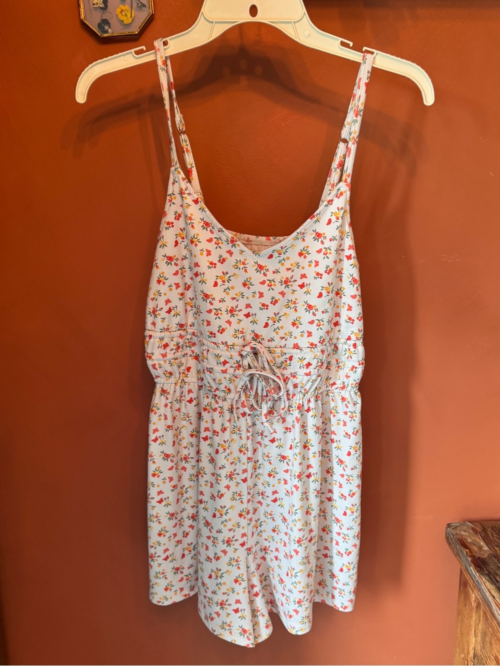 Hollister Cream Floral V-Neck Romper with Orange Accents